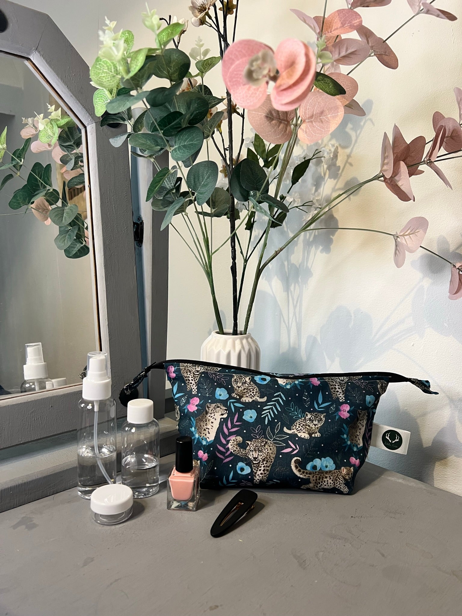 Stylish snow leopard makeup bag, ideal for makeup essentials.