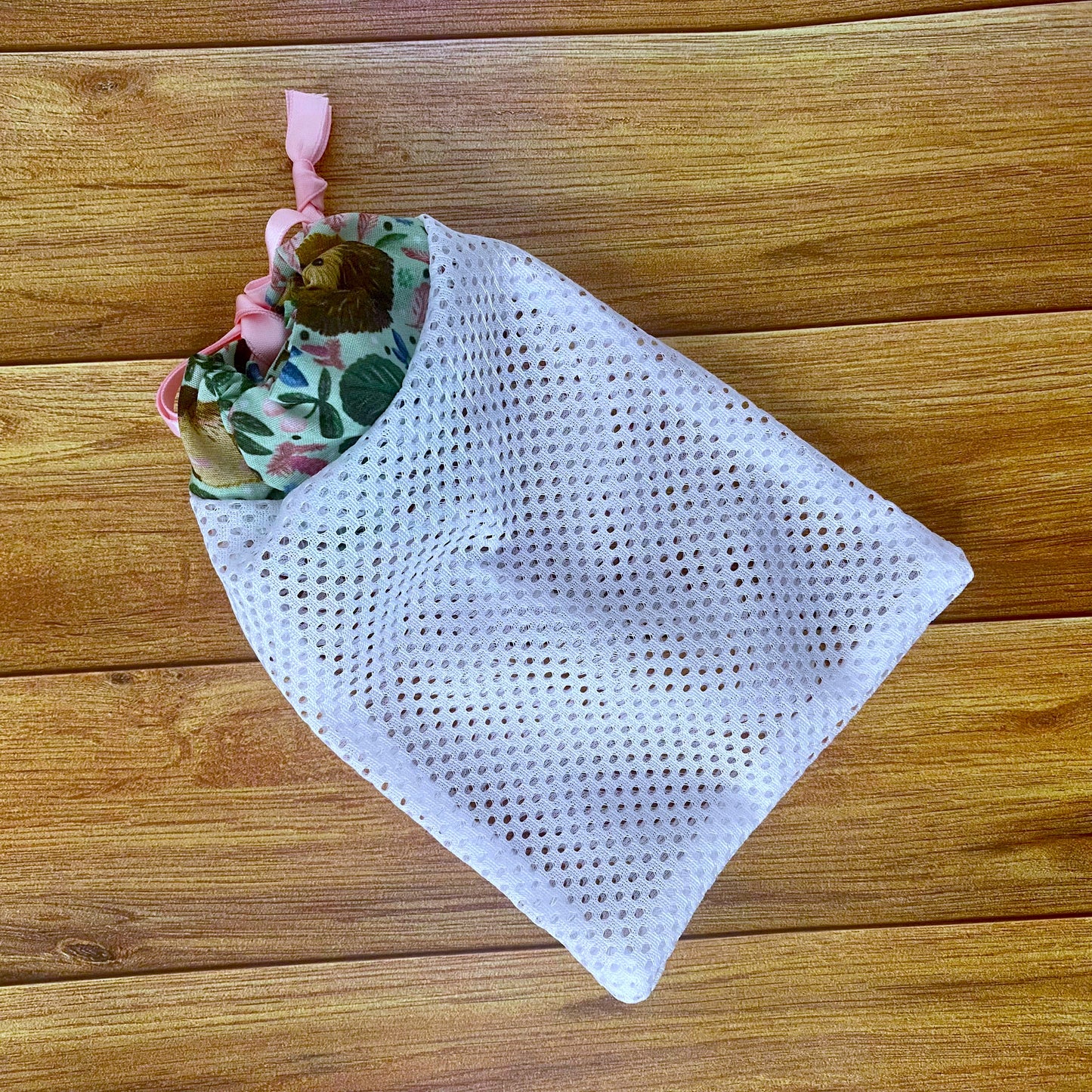 Charming hedgehog-themed drawstring makeup bag, perfect for sustainable skincare routines and organizing beauty essentials.